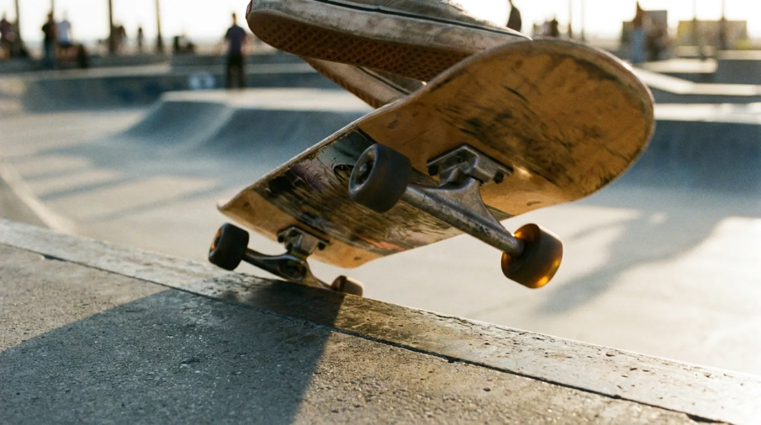 Skateboard mid-air showing rotation on two separate axes during a combined flip trick